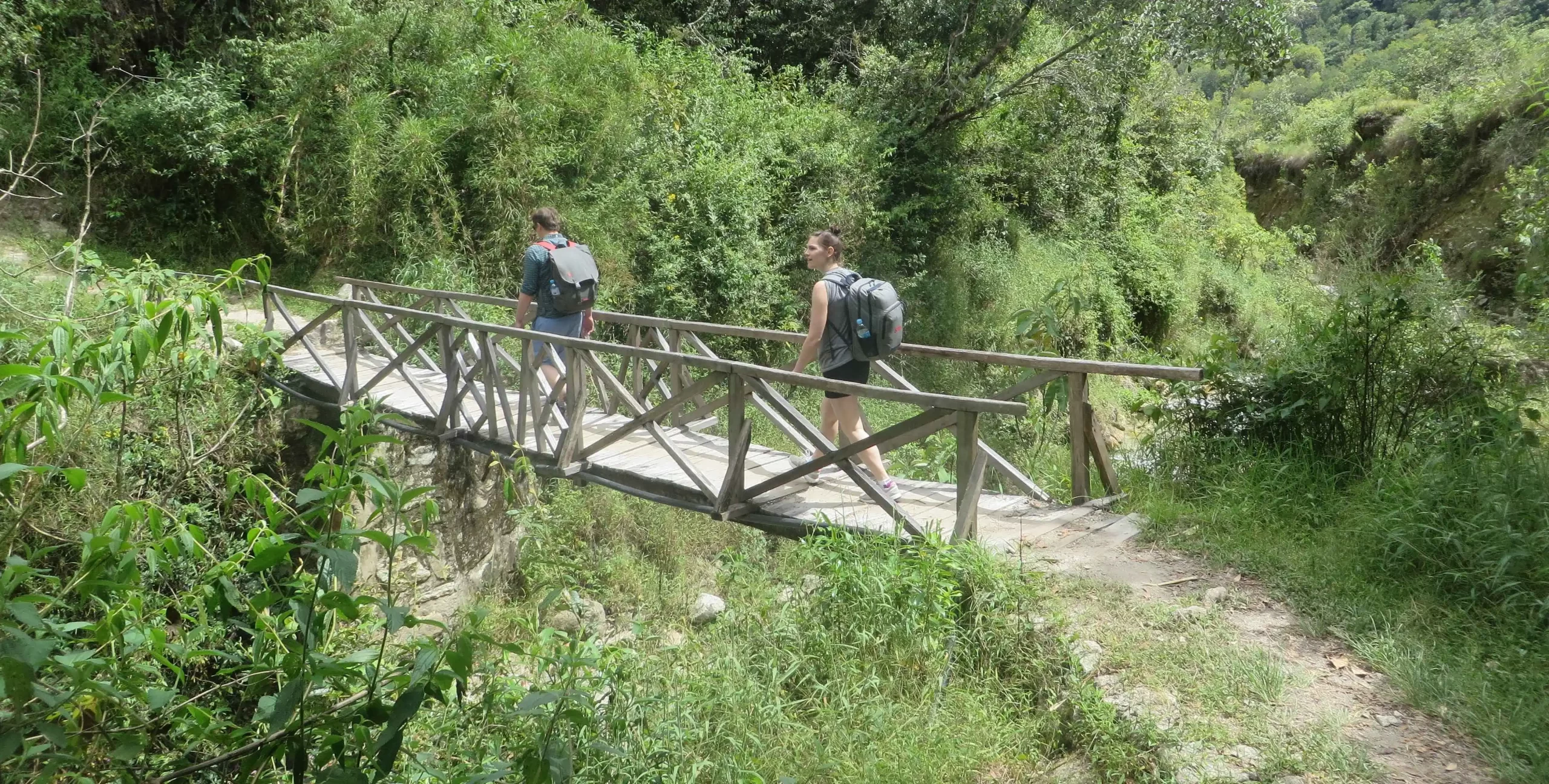 Hiker exploring the Short Inca Trail from Km 104 to Machu Picchu, walking along original Inca stone paths